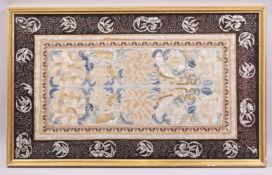 A CHINESE EMBROIDERED TEXTILE PANEL, embroidered with large flower heads, mounted with later
