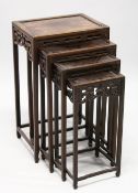A GOOD NEST OF FOUR CHINESE ROSEWOOD RECTANGULAR TABLES, each with pierced and carved frieze on