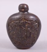 A CHINESE CARVED SNUFF BOTTLE AND STOPPER, with a panel to each side depicting deer, bats and a