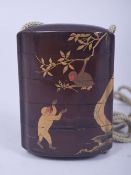 A JAPANESE LACQUER FOUR CASE INRO, decorated with monkeys and tree with gilt highlights, 7cm.