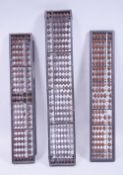 THREE UNUSUAL JAPANESE HARDWOOD ABACUS, one inlaid, the other with eight character mark, 38.5cm