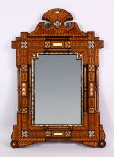 A 19TH CENTURY ISLAMIC MOORISH INLAID WOOD AND IVORY MIRROR - the frame inlaid with an array of