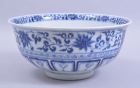A LARGE CHINESE MING STYLE BLUE AND WHITE PORCELAIN BOWL, the interior centre painted with kylin /