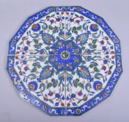A TURKISH POTTERY FOUR TILE TABLE PANEL, with vivid sprays of foliate design, each tile 21.5cm x