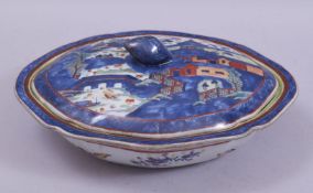 A CHINESE BLUE AND WHITE CLOBBERED PORCELAIN TUREEN AND COVER, the lid and inner tureen painted with