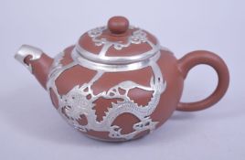 A CHINESE METAL MOUNTED YIXING CLAY TEAPOT AND COVER, the mounts of dragons, mark to base and