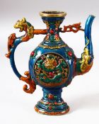 AN UNUSUAL CHINESE ENAMELLED EWER, with zoomorphic handle and spout, the body with relief roundel