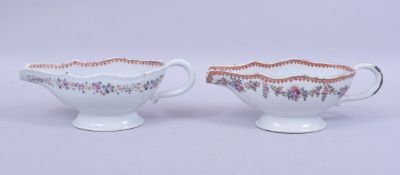 A PAIR OF 18TH CENTURY CHINESE QIANLONG FAMILLE ROSE PORCELAIN SAUCE BOATS, 24cm long.