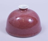 A LARGE CHINESE COPPER RED PORCELAIN BRUSH WASH, 13.5cm diameter.