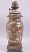 A JAPANESE SATSUMA PORCELAIN LAMP VASE with metal mounts, decorated with panels of figures,