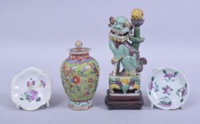 A MIXED LOT OF FOUR CHINESE ITEMS, consisting of two famille rose dishes, 8cm diameter, a lion dog