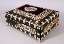 A 19TH CENTURY ISLAMIC ANGLO INDIAN VIZAGAPATAM IVORY AND HORN LIDDED BOX, with carved icvory panels