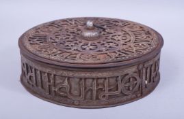 A FINE LARGE ISLAMIC SILVER INLAID OPENWORK STEEL CIRCULAR BOX AND COVER, possibly from Yemen,
