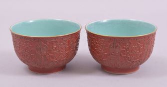 A GOOD PAIR OF CHINESE RED AND TURQUOISE GLAZE BOWLS, the exterior incised with floral motifs,
