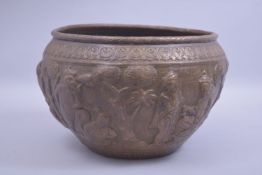 A INDIAN RELIEF COPPER / BRASS BOWL, depicting ganesh and other figures, 30cm diameter.