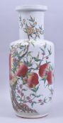 A CHINESE FAMILLE ROSE PORCELAIN LANTERN VASE, decorated with peach, flora and bats, 45cm high.