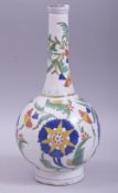 A TURKISH KUTAHYA GLAZED POTTERY BOTTLE VASE, decorated with large flower heads and foliate