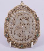 A LARGE CARVED JADE AND GILT FILIGREE PENDANT, 11.5cm x 8.5cm.