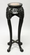A CHINESE HARDWOOD AND MARBLE INSET CIRCULAR VASE STAND, with pierced and carved frieze and