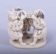 A JAPANESE MEIJI PERIOD CARVED IVORY NETSUKE - THREE ACTORS, the three dancing actors with a fan and