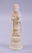 A JAPANESE OR CHINESE 19TH CENTURY CARVED IVORY GODDESS, two character mark to base, 11cm high.