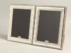 A LARGE PAIR OF SILVER PHOTOGRAPH FRAMES 8.5ins x 3.75ins
