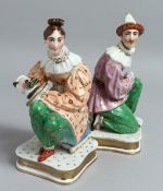 A PAIR OF JACOB PETIT PORCELAIN FIGURES with detachable heads, on square bases. 9ins high.