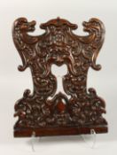 A GOOD SGABELLO CARVED WOOD PANEL. 16ins x 13ins.