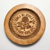 A LARGE WOODEN CIRCULAR BUTTER MOULD 