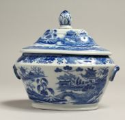A STAFFORDSHIRE BLUE AND WHITE SHAPED TUREEN AND COVER, possibly Turner, circa. 1800. 5.5ins long.