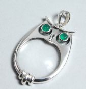 A SILVER OWL SPY GLASS.