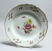 A 19TH CENTURY MEISSEN PORCELAIN PLATE, painted with flowers. Cross swords mark in blue 9.5ins