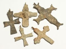 FIVE ROMAN METAL CROSSES. 3ins long.