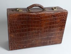 AN ARMY AND NAVY, LONDON, CROCODILE SUIT CASE. 19ins long x 12ins deep x 6ins high.