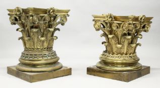A GOOD PAIR OF LARGE CAST BRASS CORINTHIAN COLUMN CAPITALS, end standing on a square base with