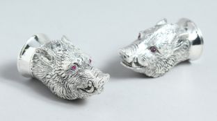 A PAIR OF .800 BOARS' HEADS SALT AND PEPPERS