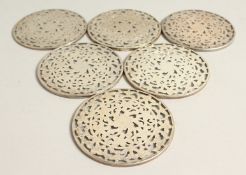 SIX SILVER AND GILT CIRCULAR GLASS STANDS/ COASTERS.