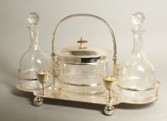 A SILVER PLATED DECANTER AND BISCUIT SET comprising a pair of decanters and oval biscuit barrel.