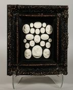A FRAMED COLLECTION OF TWENTY PLASTER MEDALLIONS.