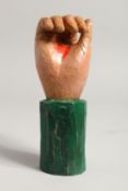 A CARVED WOOD AND PAINTED FOLK ART HAND. 7ins.