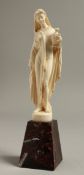 A GOOD EUROPEAN IVORY OF A CLASSICAL LADY holding an urn. 5.5ins high on a marble base.