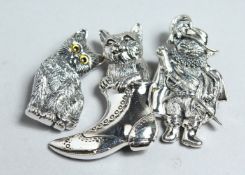 THREE SILVER CAT BROOCHES.
