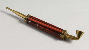AN UNUSUAL OPIUM PIPE. 8ins long,