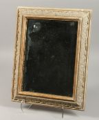 A GOOD FRAMED LIMEWOOD MIRROR. 15ins x 11ins.