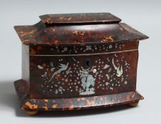 A GOOD REGENCY TORTOISESHELL SERPENTINE-FRONTED TWO-DIVISION TEA CADDY inlaid with mother of pearl
