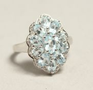 A SILVER AND AQUAMARINE RING