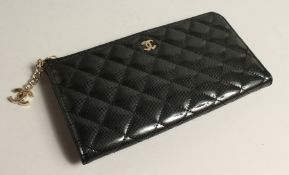 A LADIES BLACK PATENT LEATHER , QUILTED CLUTCH BAG, boxed.