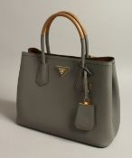 A LADIES PRADA GREY LEATHER HANDBAG