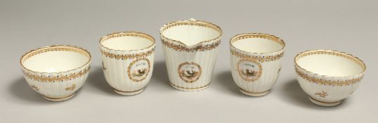 AN 18TH CENTURY RARE CREAM JUG, two cups and two tea bowls, painted with two doves and the word l'