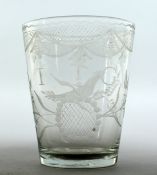 AN EARLY GLASS BEAKER engraved with birds and flowers and initial I G. 4ins high.